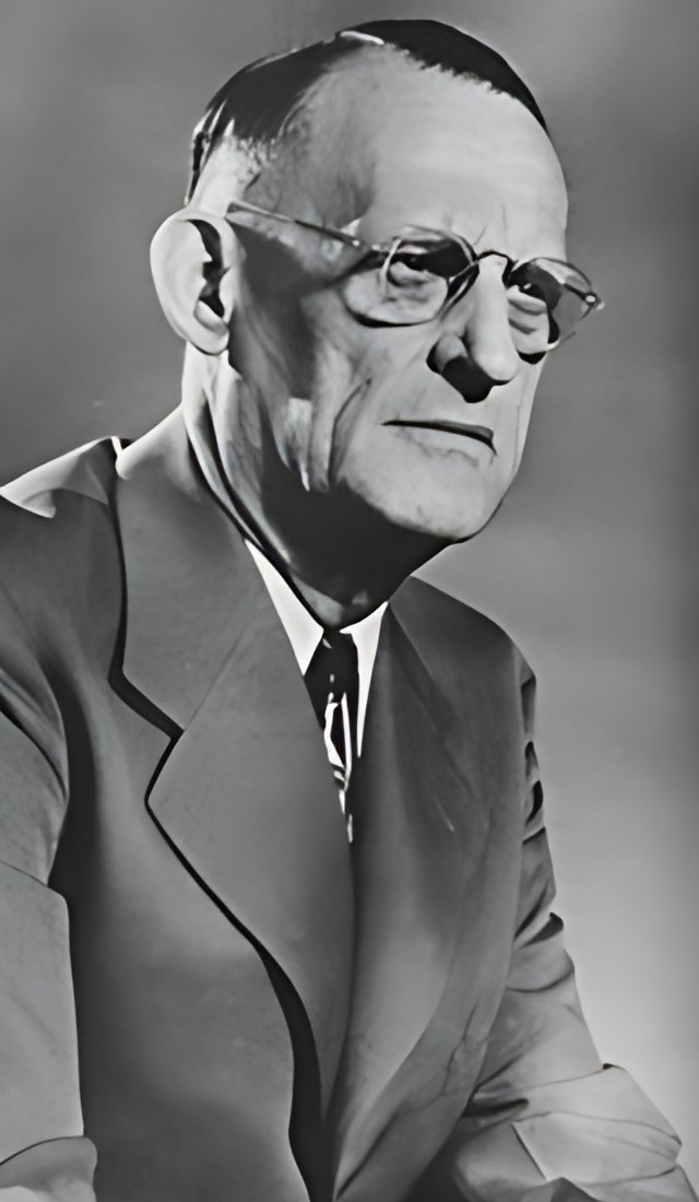 Black-and-white vintage portrait of Dr. Bob, co-founder of Alcoholics Anonymous, wearing glasses, a suit, and tie
